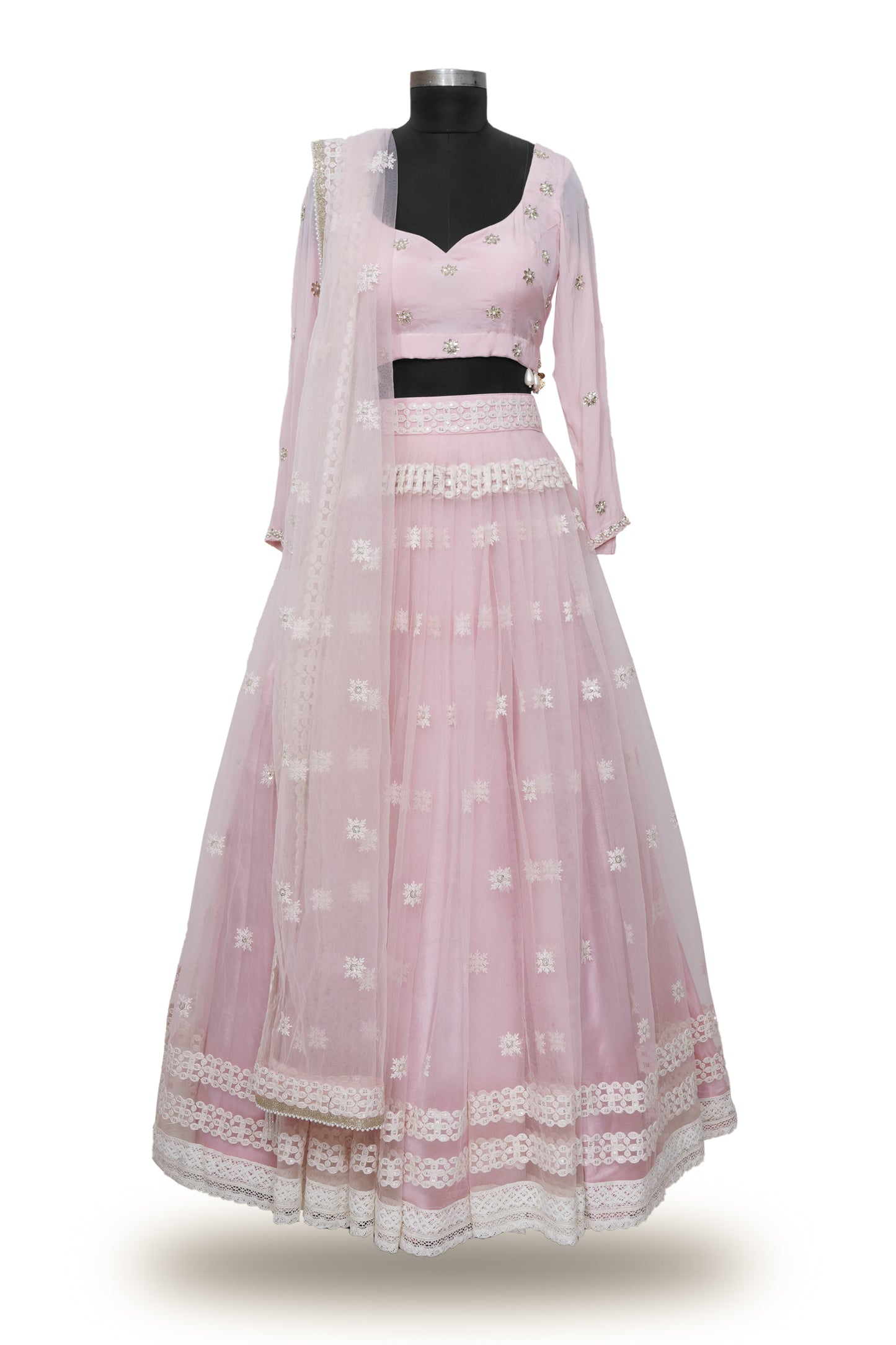 "Radiant in Pink: A Tulle Lehenga with Hand-Embroidered Blouse Adorned with Embellished Hangings"